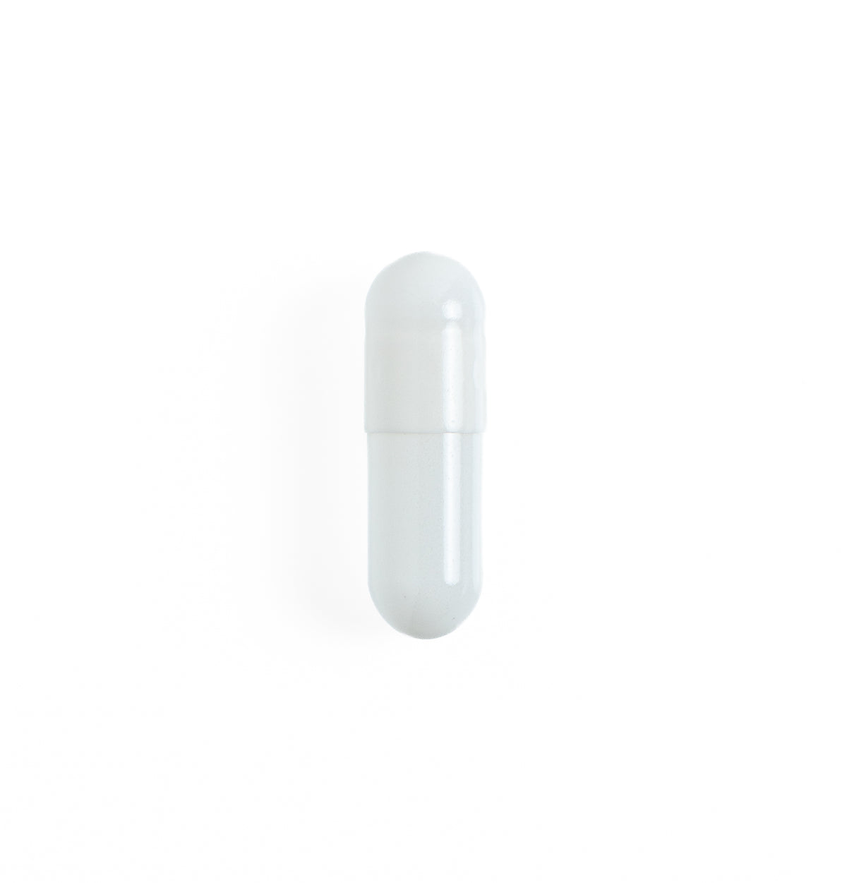 Single empty white gelatin capsule standing upright on a plain white background, from X-Caps